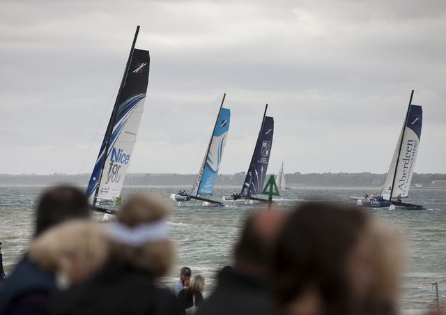 Spectators watch the Fleet From the race village (Photo by Lloyd Images)
