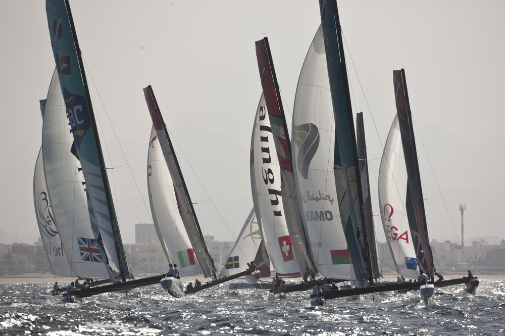 EX40 catamaran fleet in action during a practice day. Close to the Muscat shoreline (Photo © Lloyd Images)