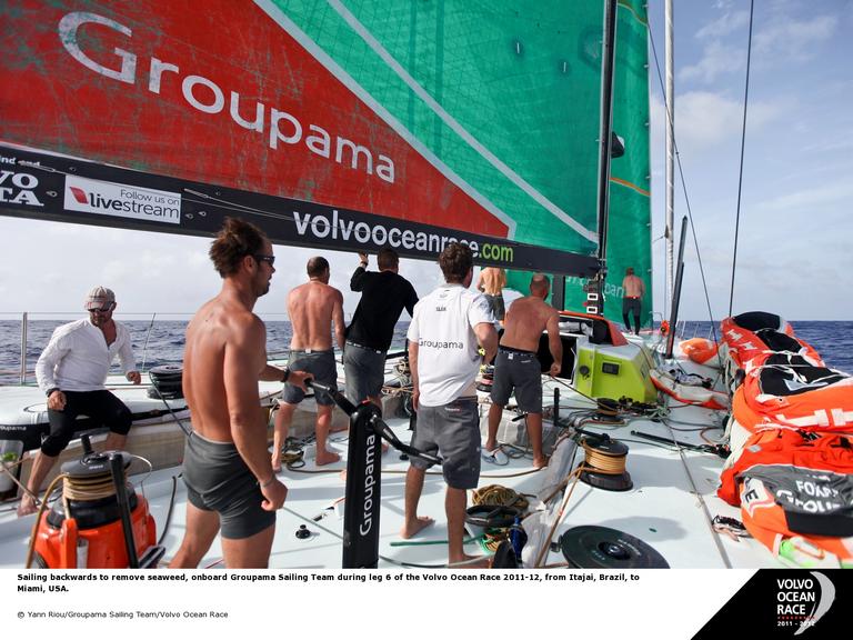 Sailing backwards to remove seaweed, onboard Groupama Sailing Team during leg 6 of the Volvo Ocean Race 2011-12, from Itajai, Brazil, to Miami, USA. (Photo by Yann Riou/Groupama Sailing Team/Volvo Ocean Race)